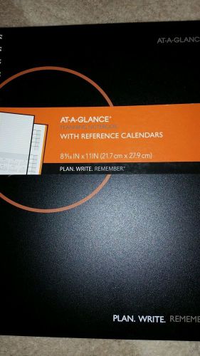 At-a-glance planning notebook with reference calendars