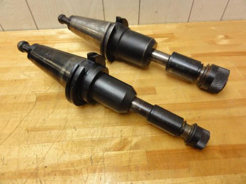 (2) cat50 end mill tool holders, with universal engineering tapping adapters for sale