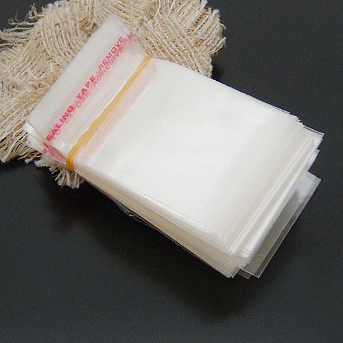 Bag, plastic, clear, 7x4mm with adhesive strip.Sold per pkg of 400. JD008