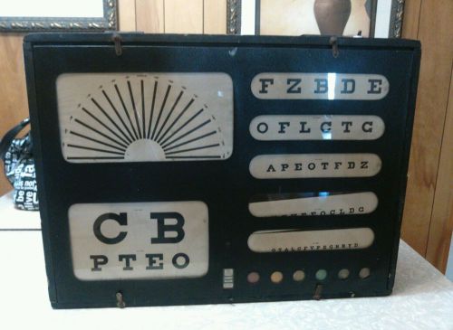 Wall hanging antique light up eye test box by green test cabinet company. for sale