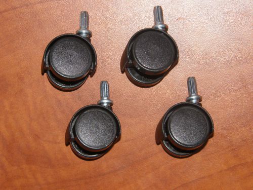 Set of 4 replacement black swivel plastic wheel office chair anything casters for sale