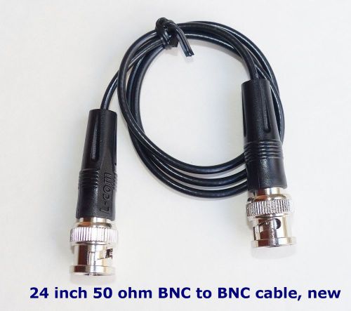 New 24 inch 50 ohm RG-174 coaxial cable with protective boots on connectors.