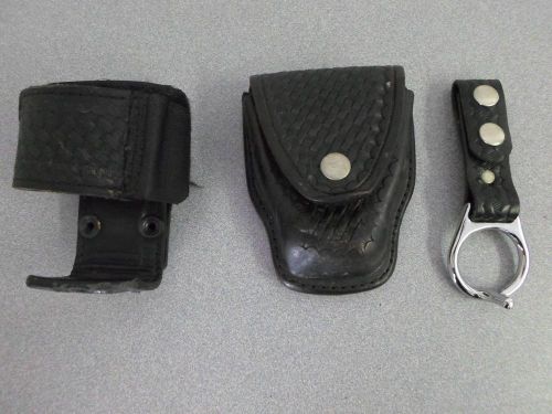 Lot of 3 duty belt acc: aker 508 handcuff pouch,xts-3000 radio holder,baton ring for sale