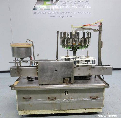 Used- pacific 16-head positive displacement rotary liquid filler. includes stain for sale
