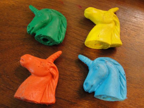 Four unicorn erasers - orange, green, blue, and yellow for sale