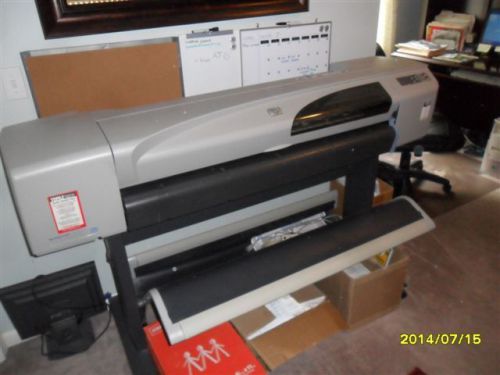 HP Designjet large format printer model# C7770B. Ink and paper included