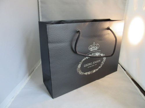 Embossed paper gift, shopping bag.Georg Jensen designer store.Black,silver logo