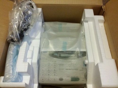 PANASONIC KX-FP105 Phone/Fax Machine NEW OPEN BOX NEVER REMOVED FROM THE BOX.