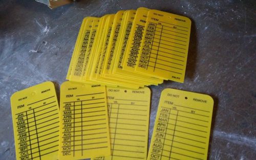 32-H.D. PLASTIC MONTHLY INSPECTION TAGS HIGH-DENSITY YELLOW INDOOR/OUTDOOR USE