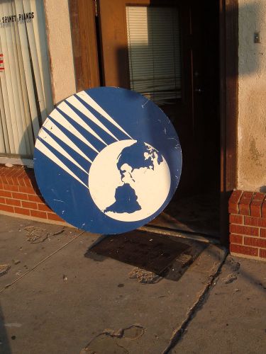Round sign made of aluminum, royal blue color with white design