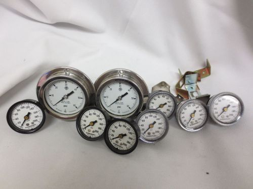 Pile-o-pressure gauges.  assortment of nine gauges for sale