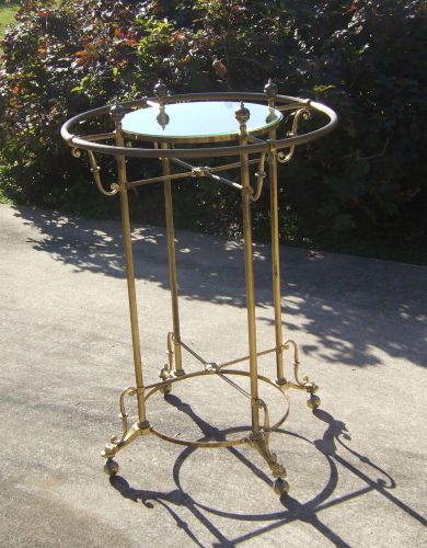 Vintage boutique brass round rolling display rack for hanging clothing separates for sale