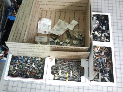 Assorted knobs, resistors, capacitors, diodes, used and new parts