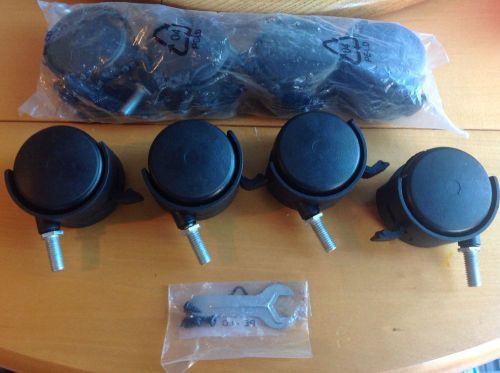Quantity of (4) 2&#034; twin caster swivel black plastic wheels with brakes for sale