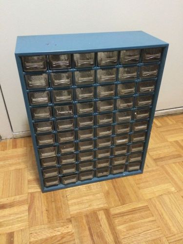 Vintage blue metal cabinet with 60 hard plastic gadget drawers for sale