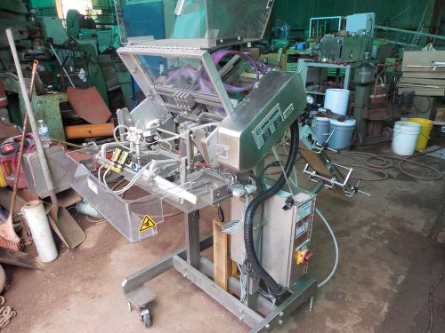 Graphic packaging outserter with nordson hot melt heads for sale