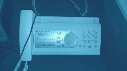 Complete Sharp ux-p100 fax machine with cable and paper inside