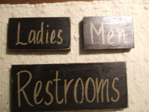 Set of three Black primitive Restroom, men and ladies signs