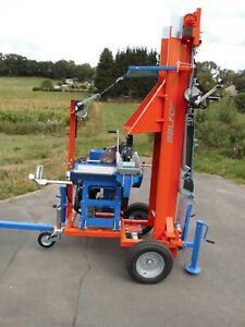 Balfor Shark 750 gas powered buzz saw with conveyor on trailer.