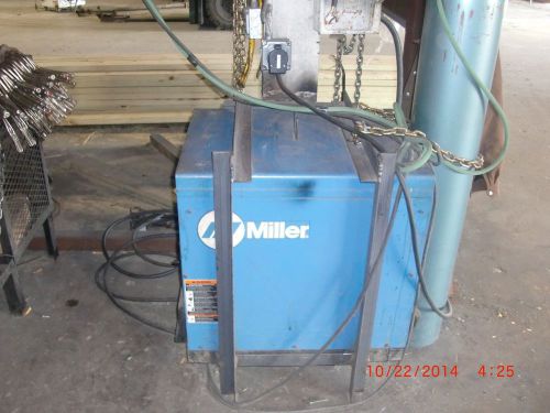 Miller cp 302  mig welder with wire feeder and swing arm for sale