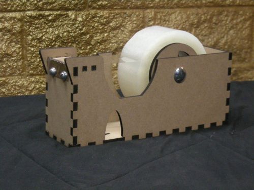 Tape dispenser. Holds tape 2 inches wide with a 3 inch core 5 inch diameter
