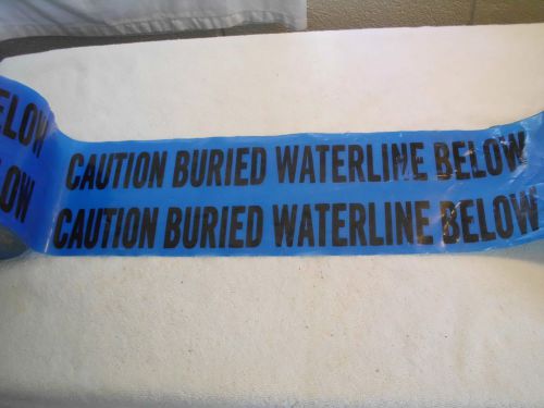 Partial roll blue &#034;caution buried water line below&#034; tape (7&#034; diameter roll) for sale