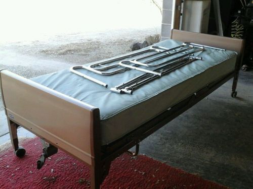 Hospital bed with siderails and motor
