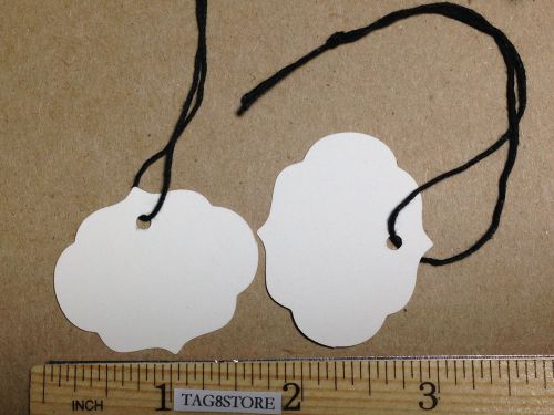 Lot 100 ornate design 1 1/2  x 1 3/8&#034; oval white price tags with string strung for sale