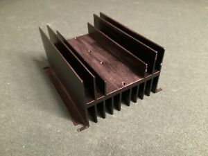 extruded aluminum heatsink, black.   anodized drilled for two solid state relays