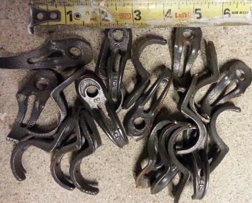 Old school cast pipe clamps, hangers, brackets to hold pipe to wall for sale