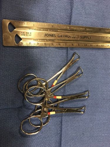 Set Of Four Small Surgical Feel Clips