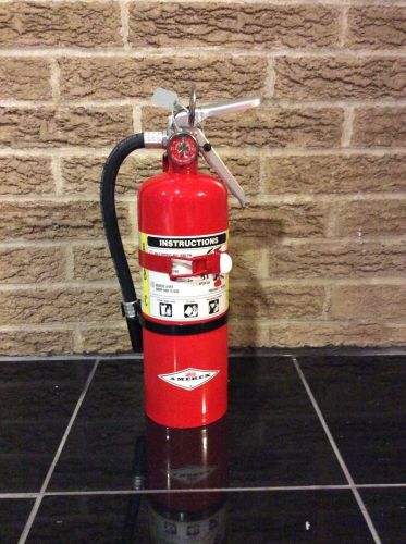 New amerex 5lb abc fire extinguisher with new inspection tag for sale