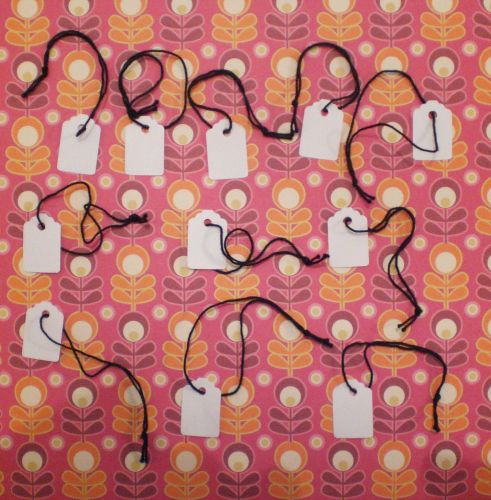 White strung jewellery tags with black strings. Size 23mm x 15mm. Pack of 50