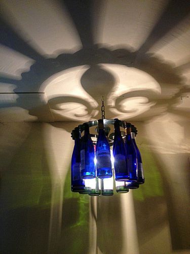 Unique fleur de lis shadow light bottle chandelier made in the usa for sale