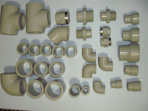 A box of 32 Georg Fischer pipe parts
