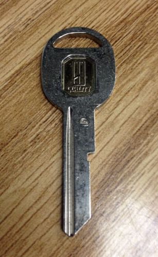 Oldsmobile rocket logo door key blank--uncut--factory original for sale