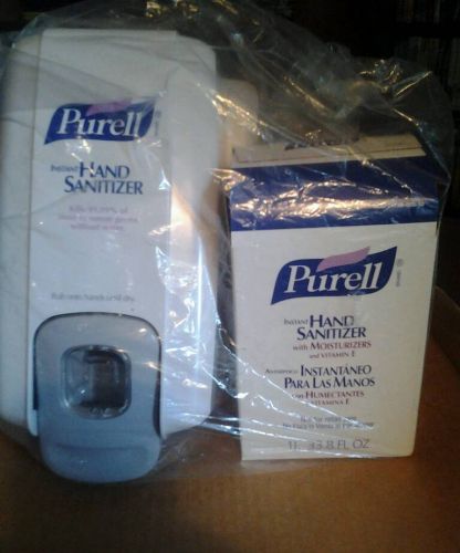 Purell hand sanitizer wall dispencer with refill.New sealed in package