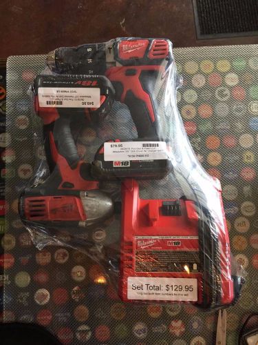 18v Milwaukee 2607-20 Hammer drill and 2650-20 Impact w/charger and 2 battery