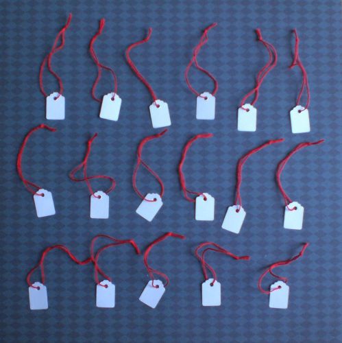 White strung jewellery tags with red strings. Size 23mm x 15mm. Pack of 50
