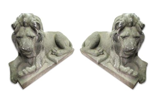 Pair of cast stone reclining lions
