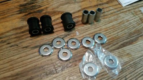 A pile of harley riser bushings and parts