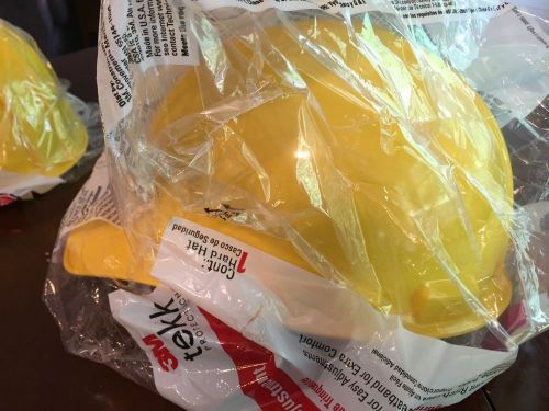 2 yellow hard hats osha approved 3 m for sale