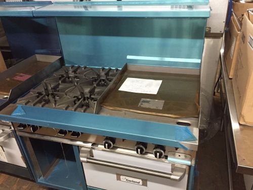 Restaurant equip - range gas 4 burner with 24&#034; griddle and std oven by garland for sale
