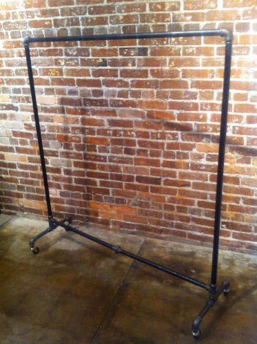 Retail store fixture vintage rolling clothing rack for sale