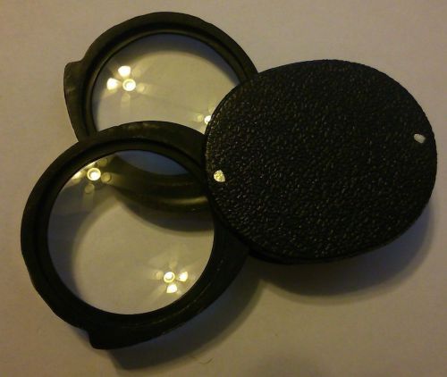 Pocket magnifier: folding double lens for sale