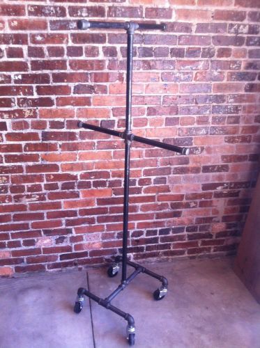 Retail store fixture vintage rolling clothing rack 4 way for sale