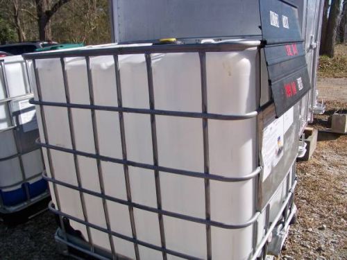 Plastic tote apx. 300gal storage tank with metal cage