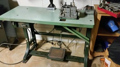 Merrow Sewing machine  toe seamer, motor , and table with light .