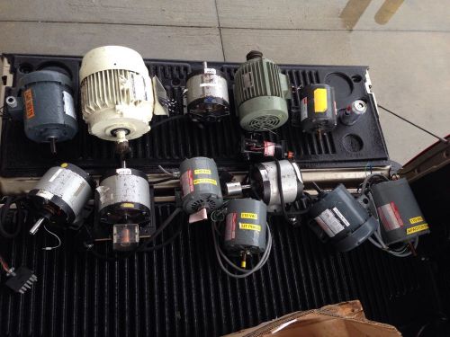 Lot of 14 motors.. All used. and motor parts.