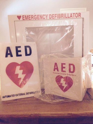 Aed cabinet with 2 aed  signs for sale